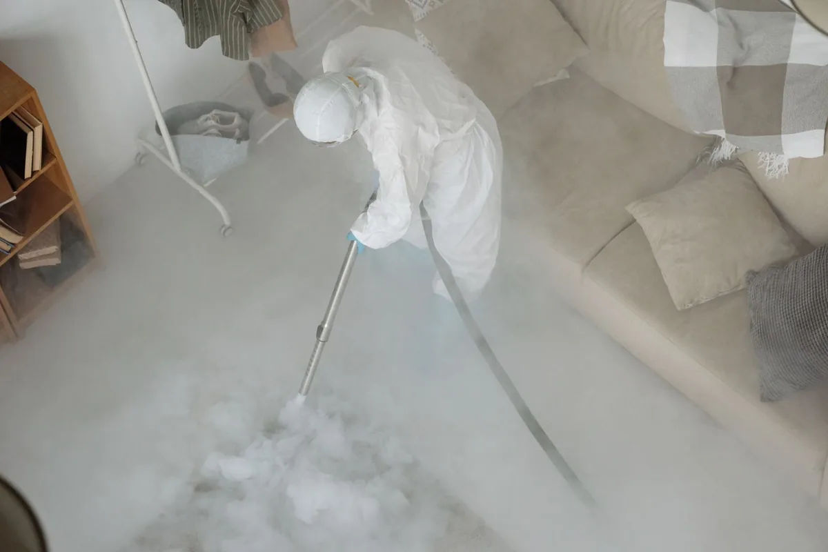 Biohazard cleanup technician in protective equipment, Shenandoah, TX